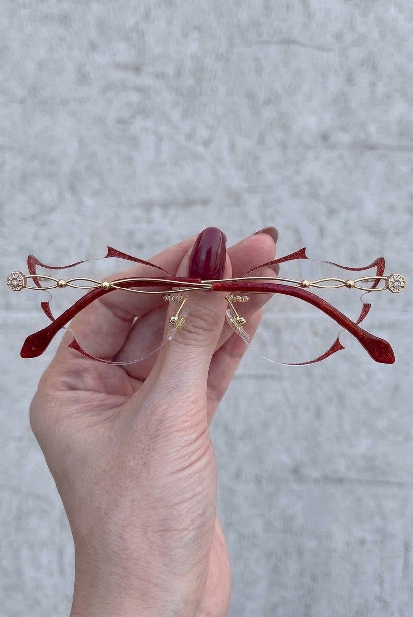 SCULPTED RIMLESSEYEWEAR WITH GLITTER ACCENTS